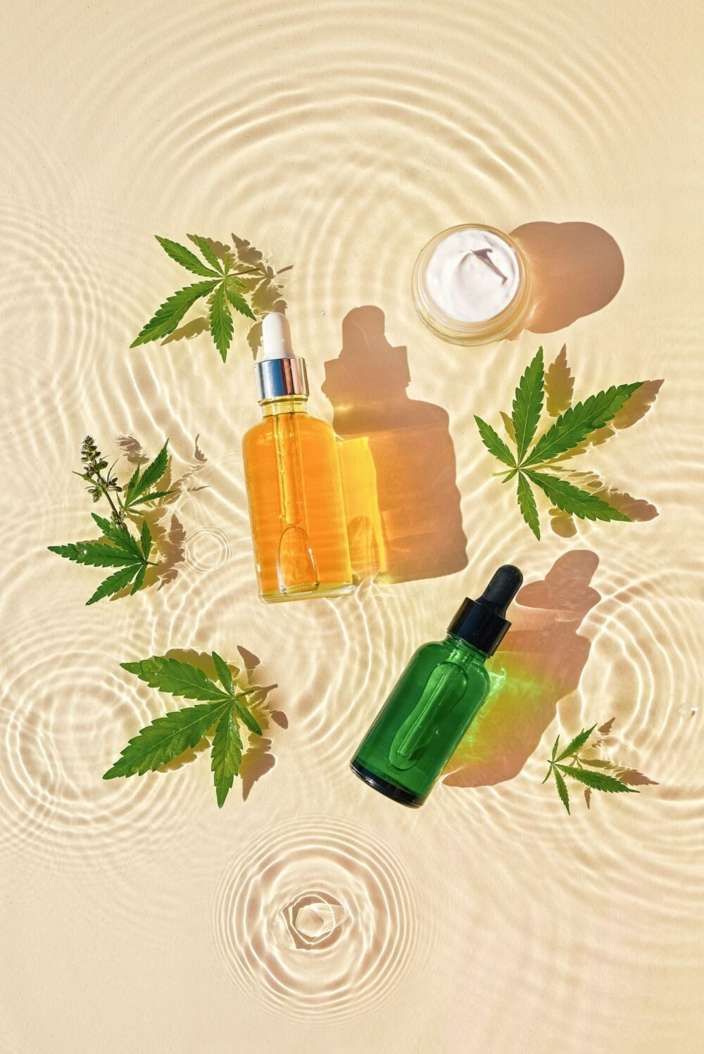 cbd-oil-cosmetics-in-jar-bottle-with-cannabis-leaves-drops-e1683181402779.jpg