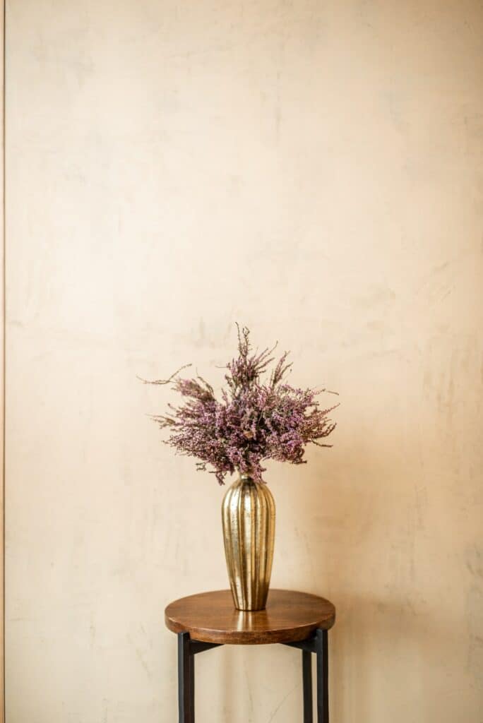 Dried Calluna flower in a gold vase