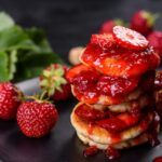cottage cheese pancakes with sliced strawberries and strawberry jam 1